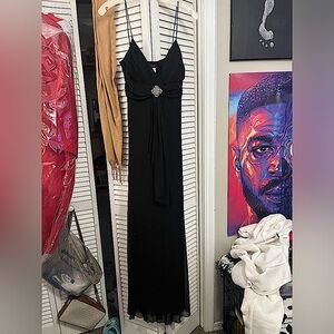 Black dress two missing stones in the little Charm thing